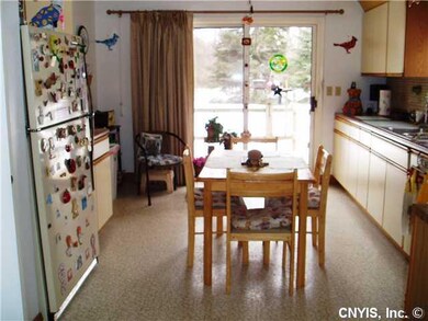 Kitchen. Eat in kitchen with siding door to deck.