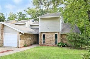 View of front of property with a garage, concrete