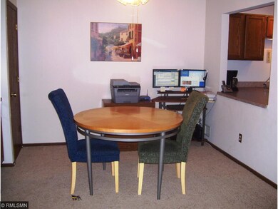 Dining area with cutout opening to kitchen. Curren
