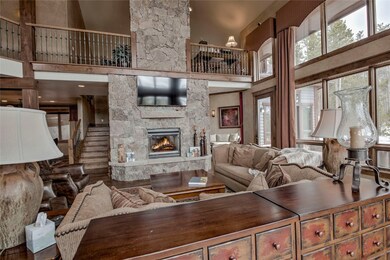 Living room featuring a towering ceiling and a fir
