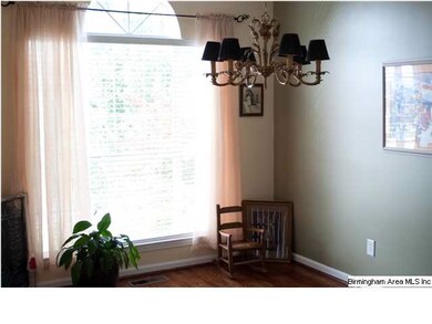 Hardwood floors and crown molding add elegance to 