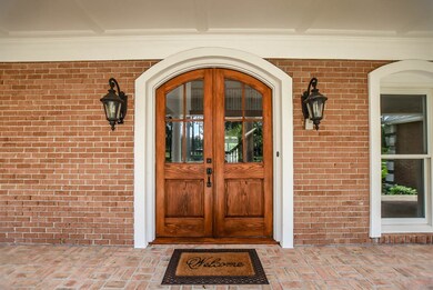 large front porch with brick pavers