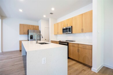 Gourmet Kitchen With Quartz Waterfall Island