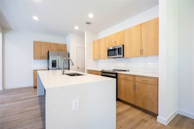 Gourmet Kitchen With Quartz Waterfall Island