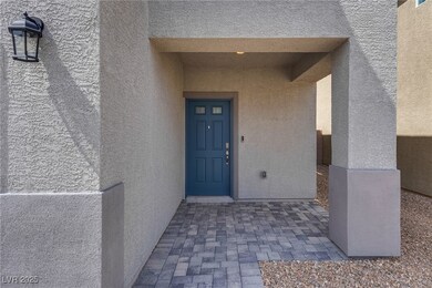 Entrance to property with stucco siding