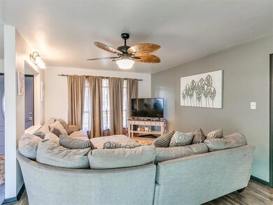 Living room with dark hardwood / wood-style floori