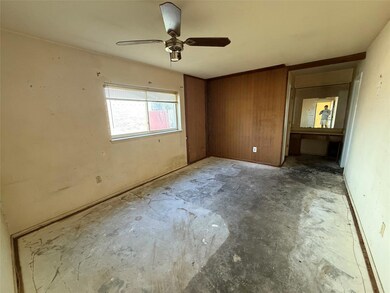 Unfurnished bedroom with unfinished concrete floor
