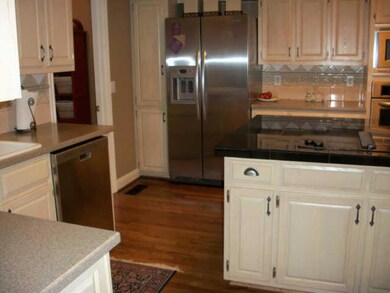 What a great Kitchen! Granite counter tops, island with Jennair cook top & seating area, NEW stainless steel appliances & plenty of storage with all these cabinets. Not to mention a desk for cookbooks & hidden storage room behind magazine rack!