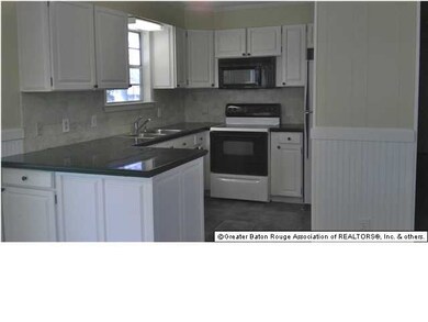 Kitchen with new counter tops and back splash