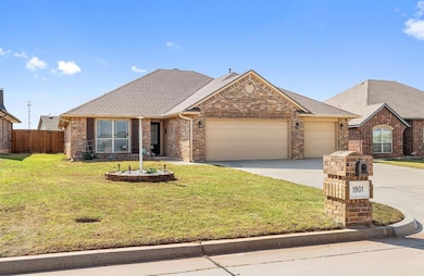 Ranch-style house with fence, an attached garage, 