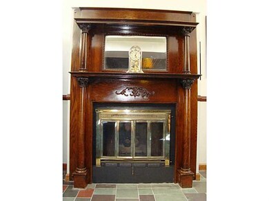 Great Room. Antique oak Victorian gas fireplace.