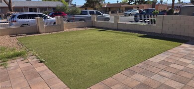 Fenced front yard with a residential view