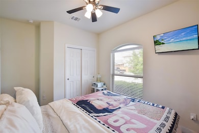 Bedroom with a closet and a ceiling fan