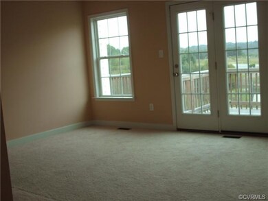 Family room w/ deck overlooking pond