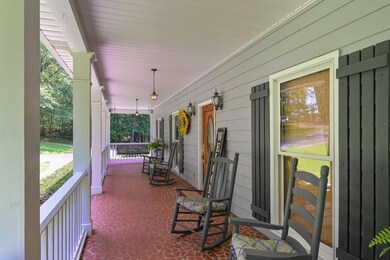 THIS PORCH IS SO LARGE AND HAS A PORCH SWING AT EACH END OF THE PORCH.