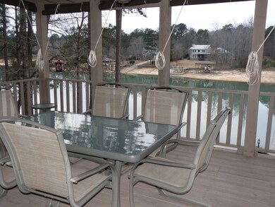 view of lake from covered deck