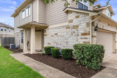 View of side of property featuring stone siding, 