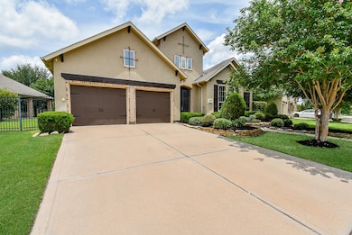 Double wide driveway to the 3 car tandem garage wi