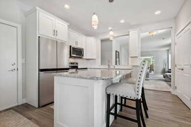 Chef's kitchen boasts newer cabinetry, including a center island with seating!