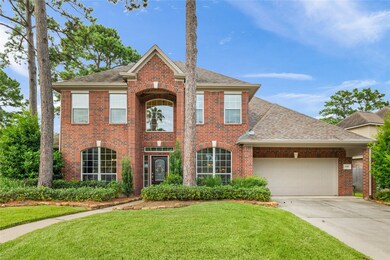 A generous two-car garage, wide driveway, and towe