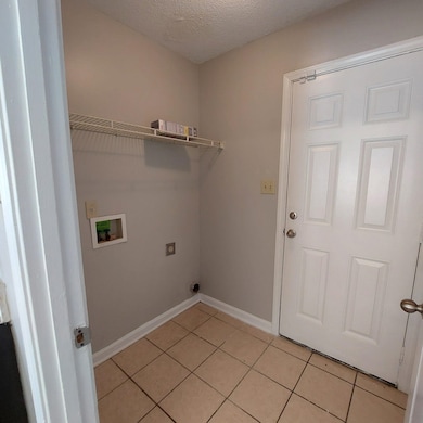 Washroom featuring washer hookup, electric dryer h