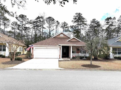 Ranch-style home with a porch, driveway, a shingle