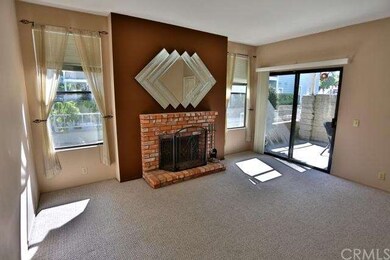 Living Room with contrast wall behind brick firepl