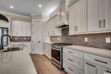 Kitchen with stainless steel appliances, a sink, o