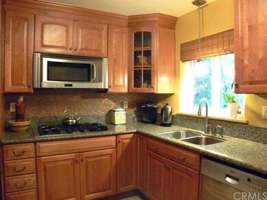 Remodeled kitchen with granite counter tops, stain