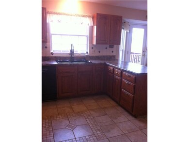 Kitchen. Custom ceramic tilework in the updated kitchen