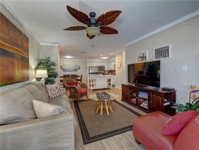 Spacious living room is open to the kitchen and di