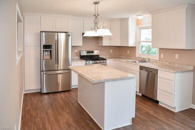 The kitchen has stainless steel appliances and a c