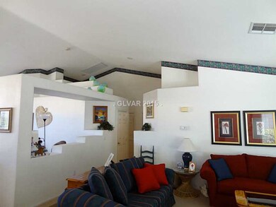 Property Photo. Tall, vaulted ceilings and pot she