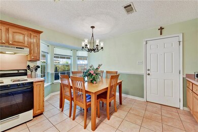Side Door leads to Covered carport/patio for enter