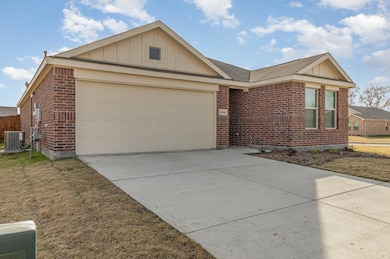 Ranch-style house with an attached garage, brick s