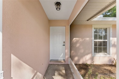 Property entrance with stucco siding