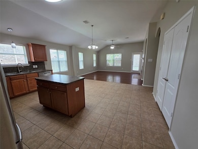 Kitchen, Dining and Living areas.