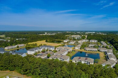 Aerial view of property and surrounding area with 