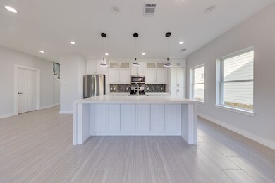 This open kitchen is perfect for hosting meals and