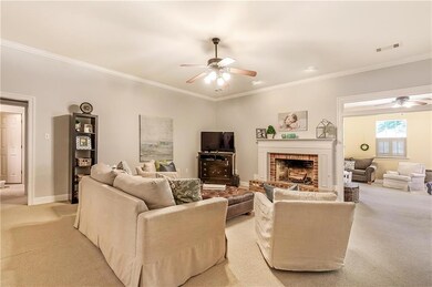 VIEW OF DEN FROM FOYER, GAS FIREPLACE