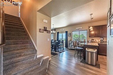 Entry with staircase to upstairs or into the kitchen.