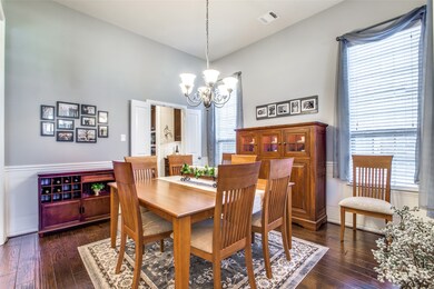 Formal dining is to the right when you enter the home.  Take note of the wainscoting and chair rail added by the seller.  Bifold doors lead to the butler's pantry.  Spacious room to host those special dinner parties with friends and family.