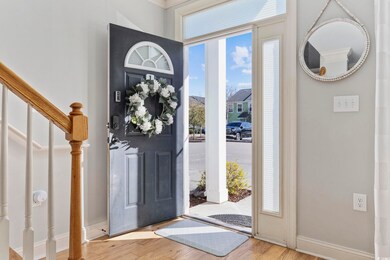 Foyer with hardwood / wood-style floors