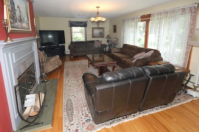Refinished hardwood floors and a fireplace; in a room large enough to have 2 focal points!