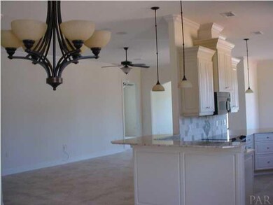 Open floor plan. From formal dining area looking to kitchen on right and great room on left.