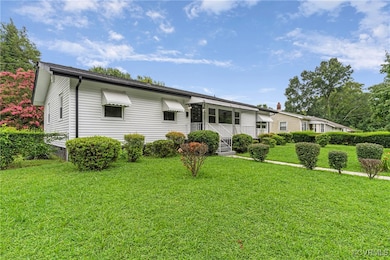 View of front of house with a front yard