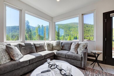Living room featuring luxury wood-style flooring a
