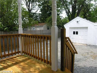 Other - Rear covered porch and view of garage with
