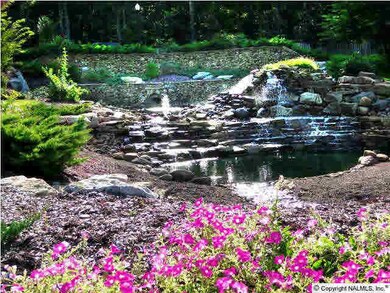 Another water feature in this gorgeous gated community is the combination waterfall & filtration system which keeps the water sparkling clean.