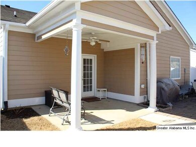 COVERED PORCH AND PATIO AREA IN THE FENCED BACK YA
